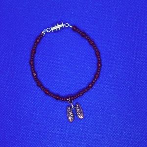 Copper lung charm on a red beaded bracelet (handmade)